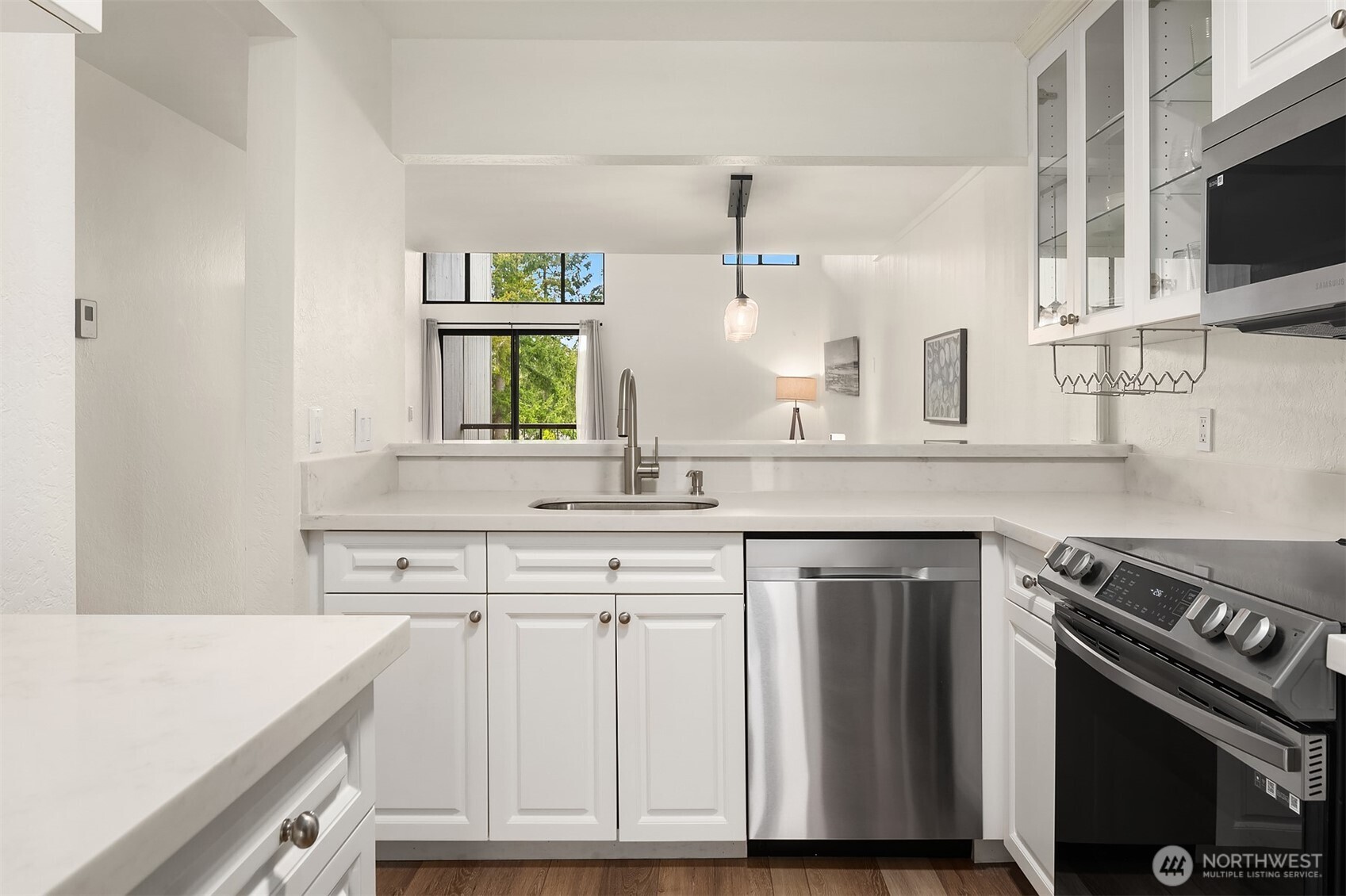 6582 137th Avenue Northeast, Unit 414 Redmond, WA 98052 - Photo 13 of 28 a kitchen with appliances cabinets and a sink