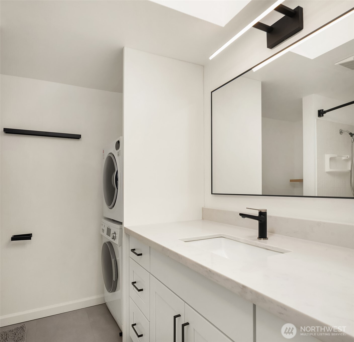 6582 137th Avenue Northeast, Unit 414 Redmond, WA 98052 - Photo 20 of 28 a bathroom with a sink and a mirror