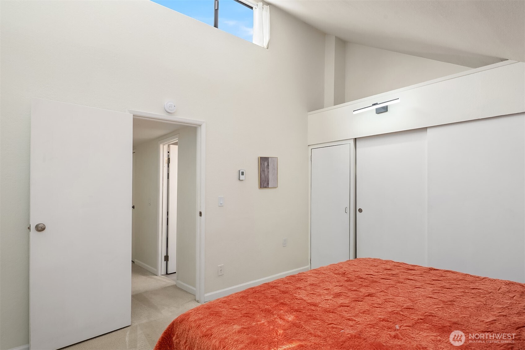 6582 137th Avenue Northeast, Unit 414 Redmond, WA 98052 - Photo 22 of 28 a bedroom with a bed and a shower