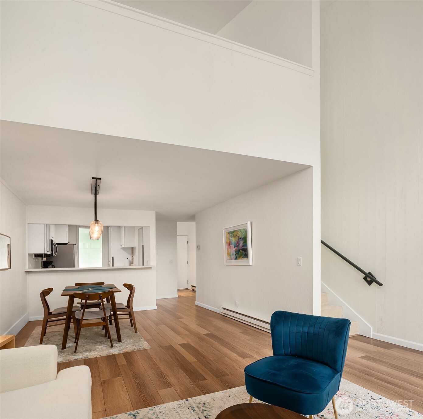 6582 137th Avenue Northeast, Unit 414 Redmond, WA 98052 - Photo 8 of 28 a living room with furniture and a wooden floor