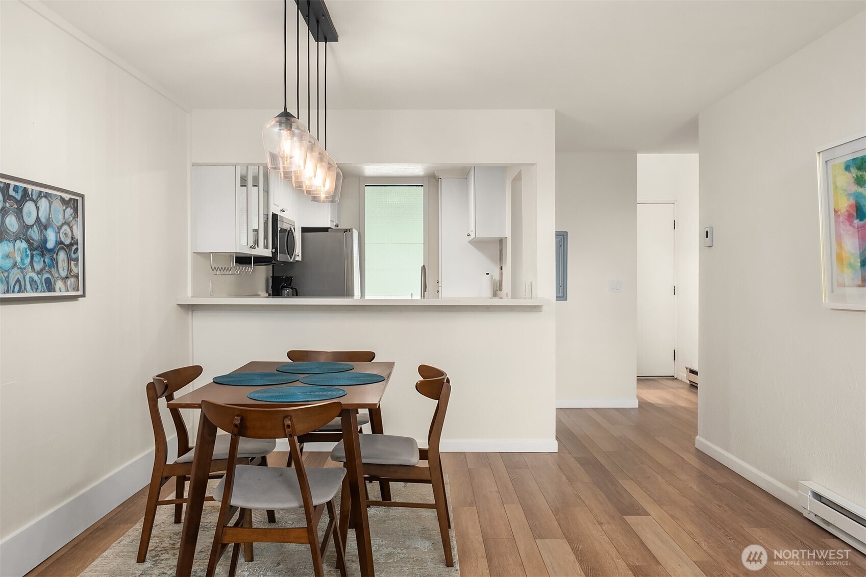 6582 137th Avenue Northeast, Unit 414 Redmond, WA 98052 - Photo 9 of 28 a view of a dining room with furniture and wooden floor
