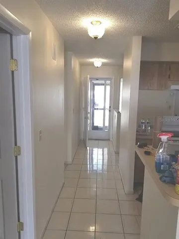 a view of entryway with kitchen