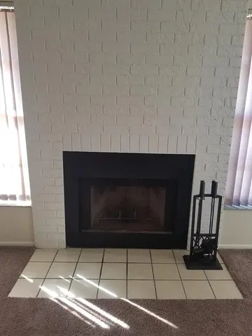 a living room with a fireplace