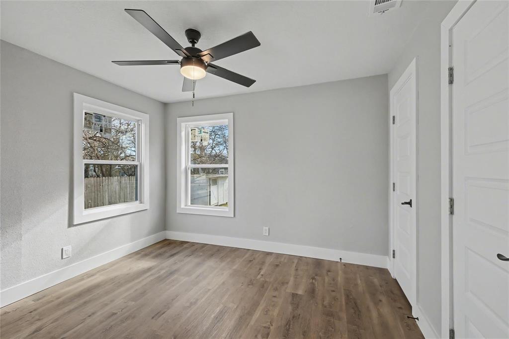 4220 Ramey Avenue Fort Worth, TX 76105 - Photo 12 of 24 a view of empty room with wooden floor and fan