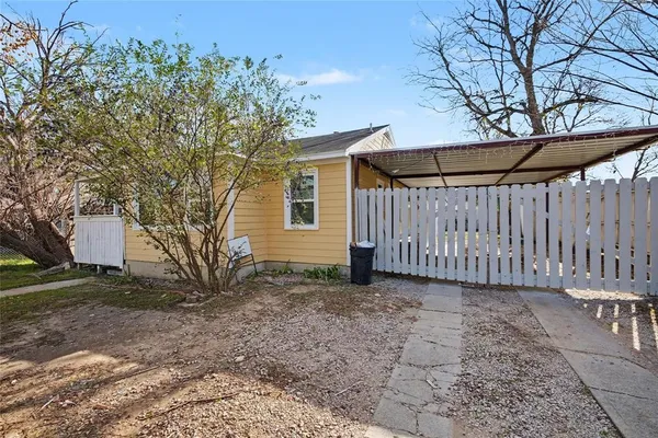 a view of a backyard with a small cabin