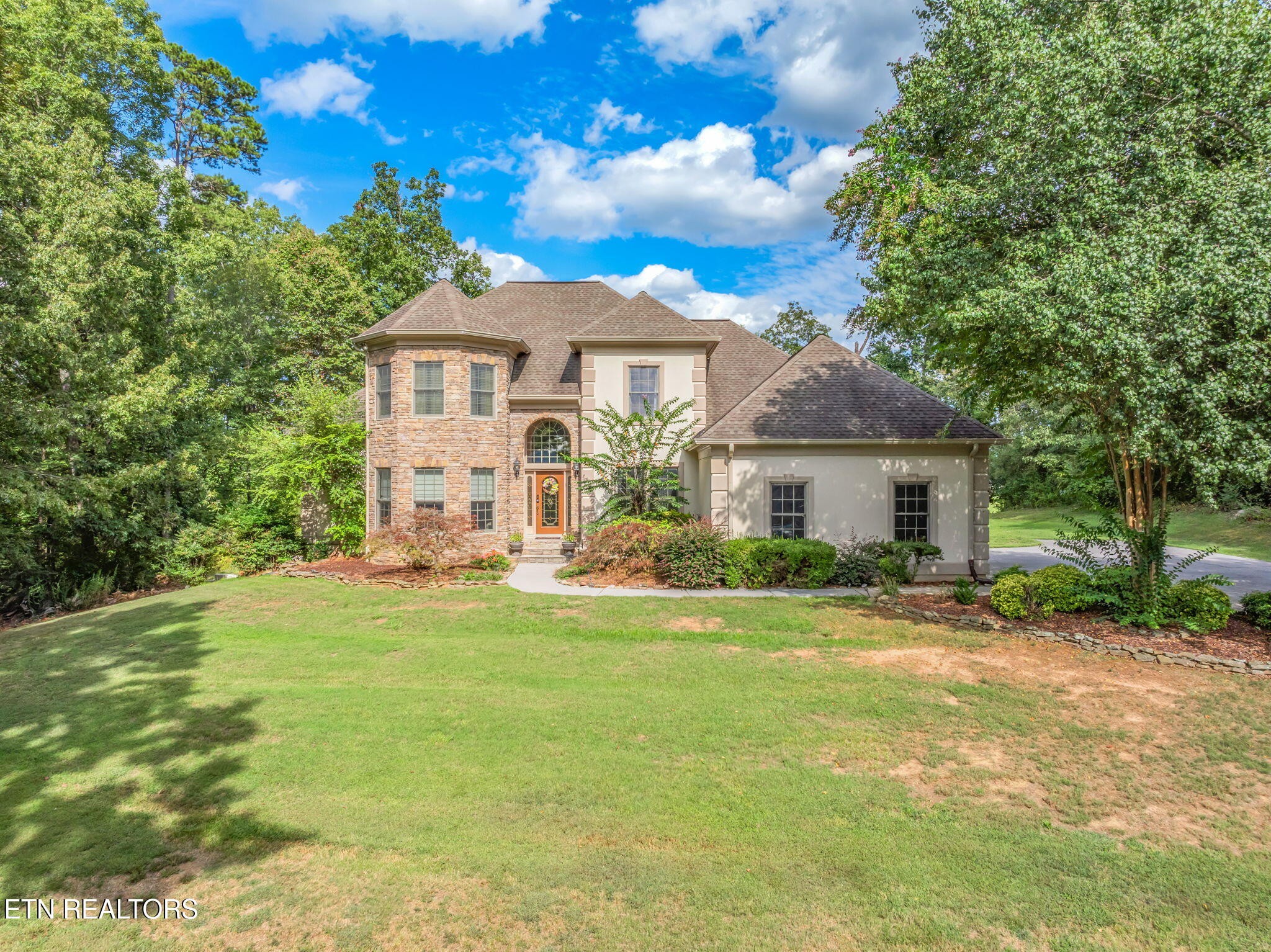 2572 Little Valley Road Loudon, TN 37774 - Photo 1 of 57 a front view of a house with a garden