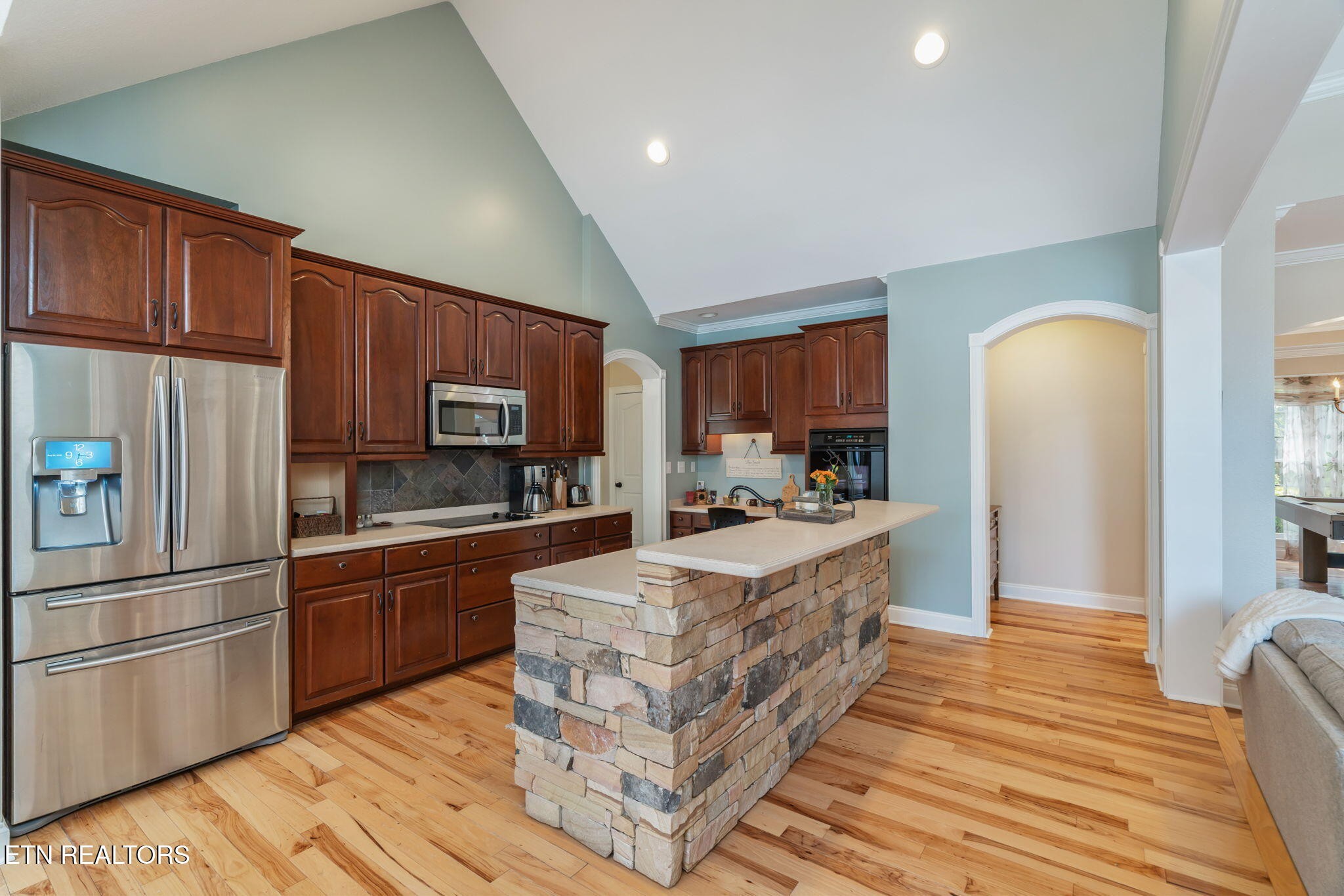 2572 Little Valley Road Loudon, TN 37774 - Photo 12 of 57 a large kitchen with stainless steel appliances granite countertop a refrigerator stove and oven