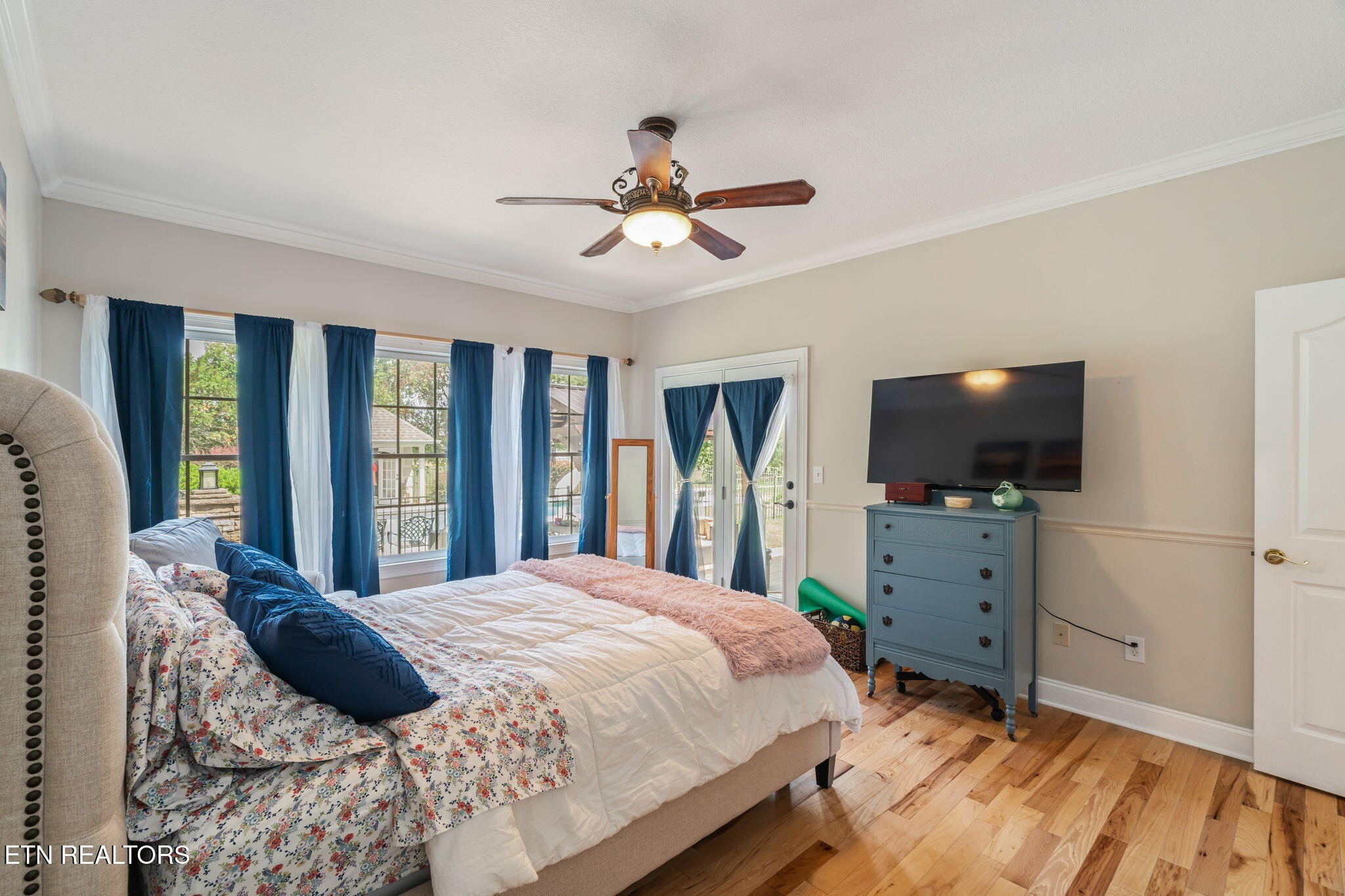 2572 Little Valley Road Loudon, TN 37774 - Photo 20 of 57 a bedroom with a bed and a flat screen tv