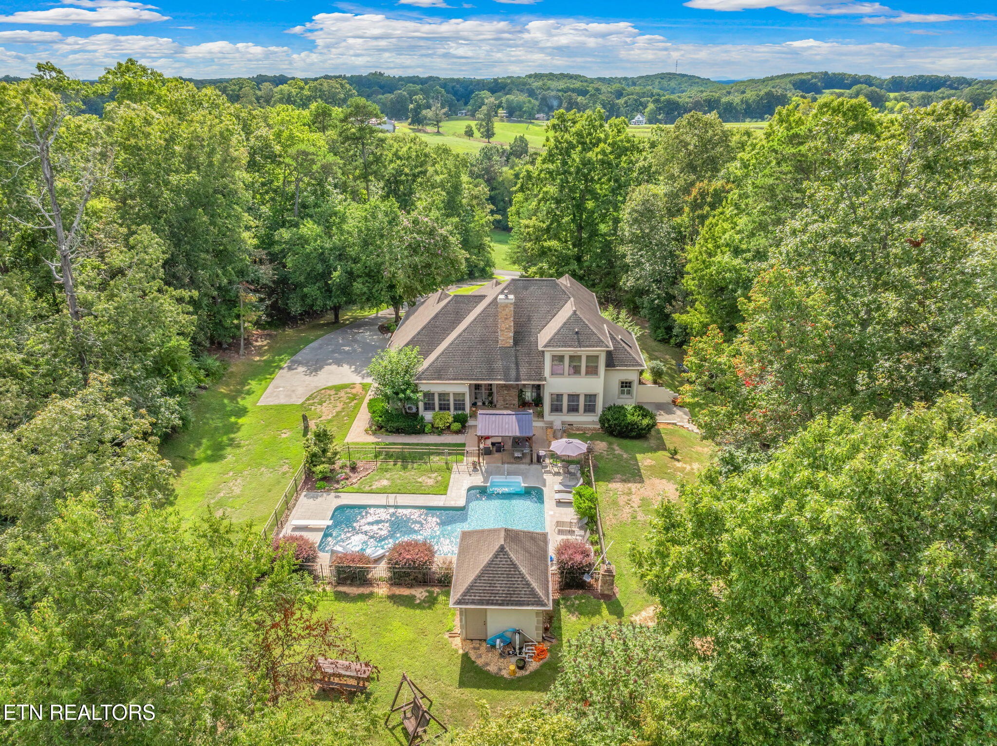 2572 Little Valley Road Loudon, TN 37774 - Photo 2 of 57 a view of a house with a yard and a large pool