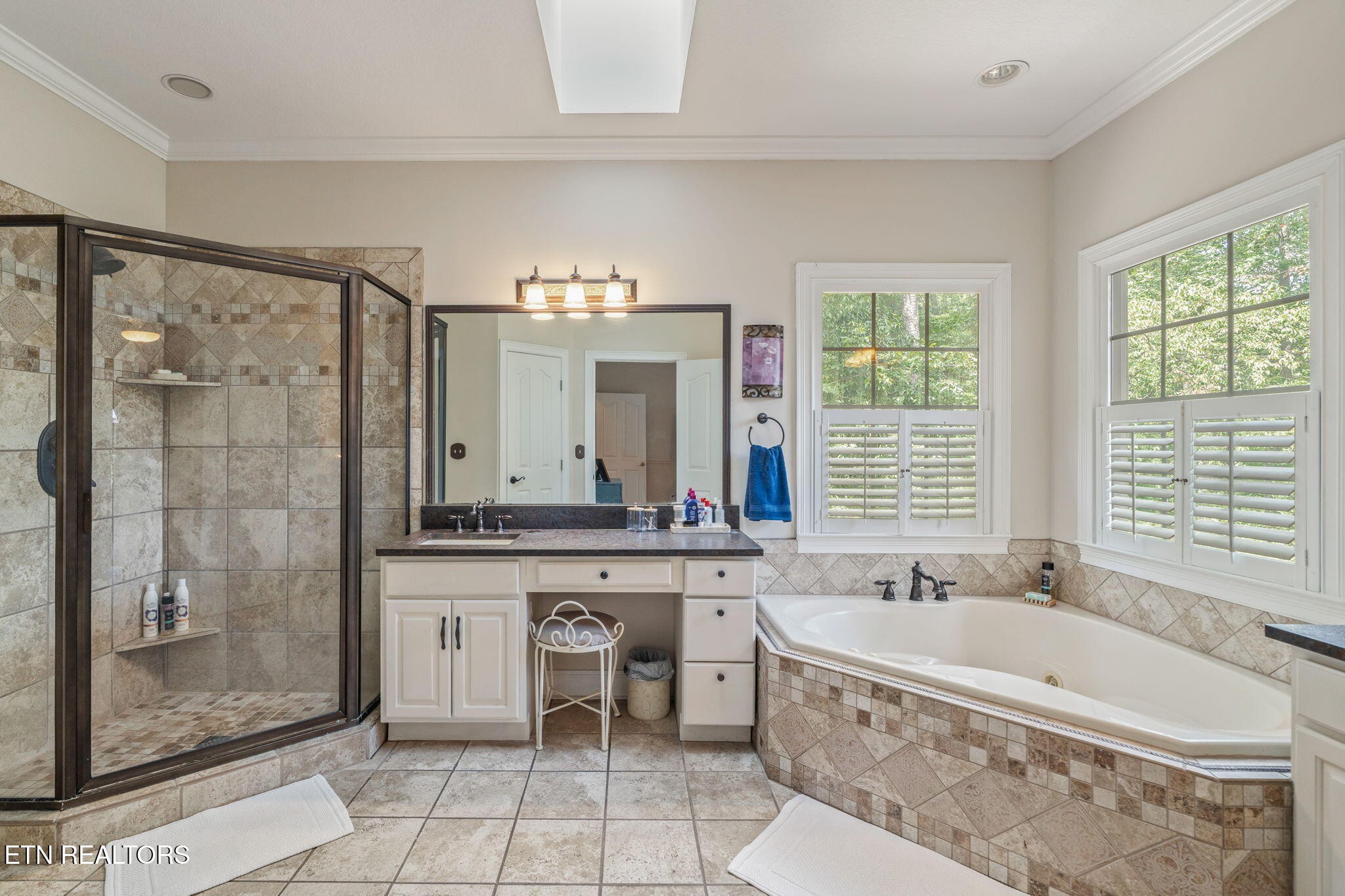 2572 Little Valley Road Loudon, TN 37774 - Photo 21 of 57 a spacious bathroom with a tub sink shower and mirror