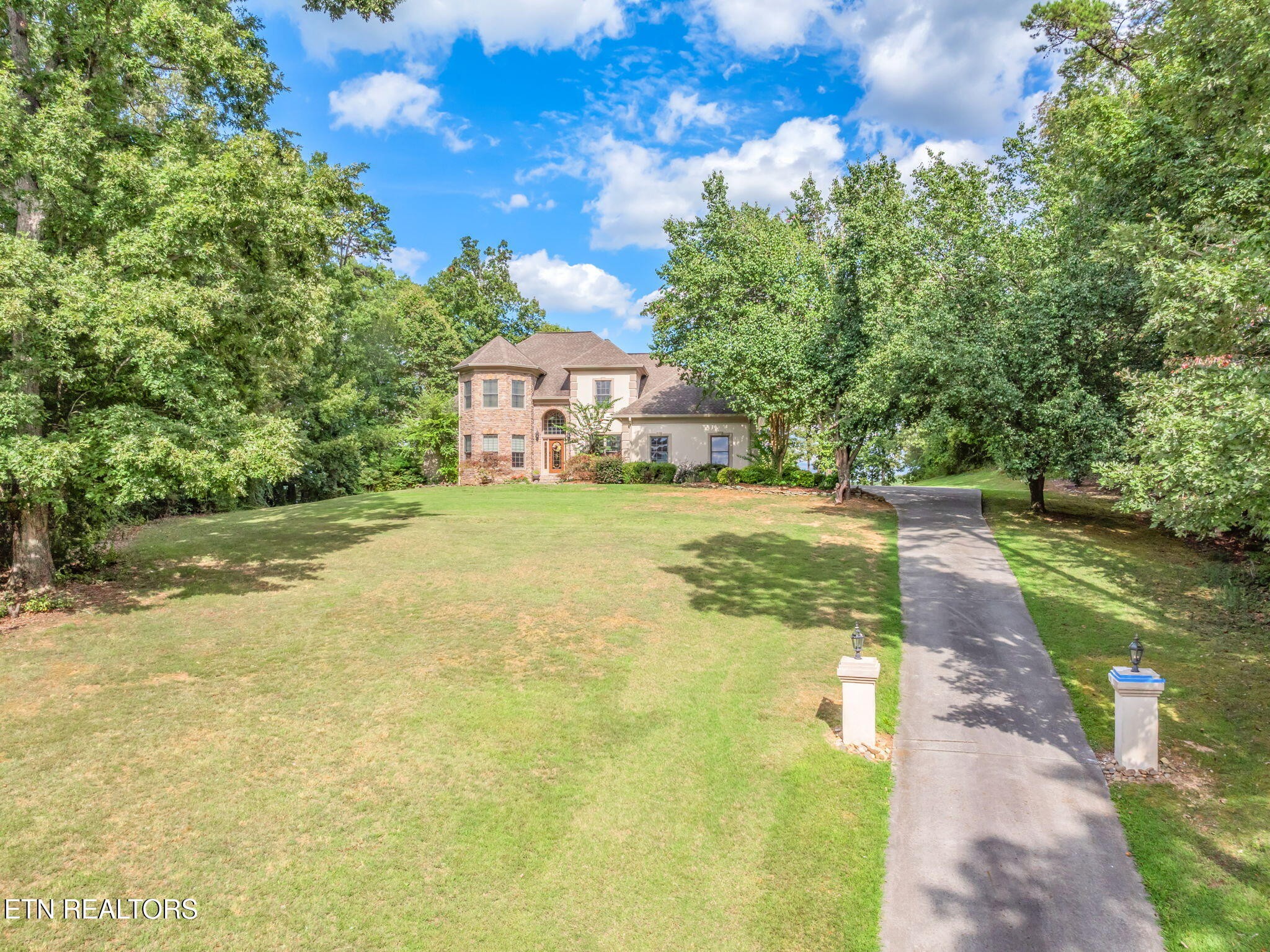 2572 Little Valley Road Loudon, TN 37774 - Photo 3 of 57 a view of a house with a yard and a garage