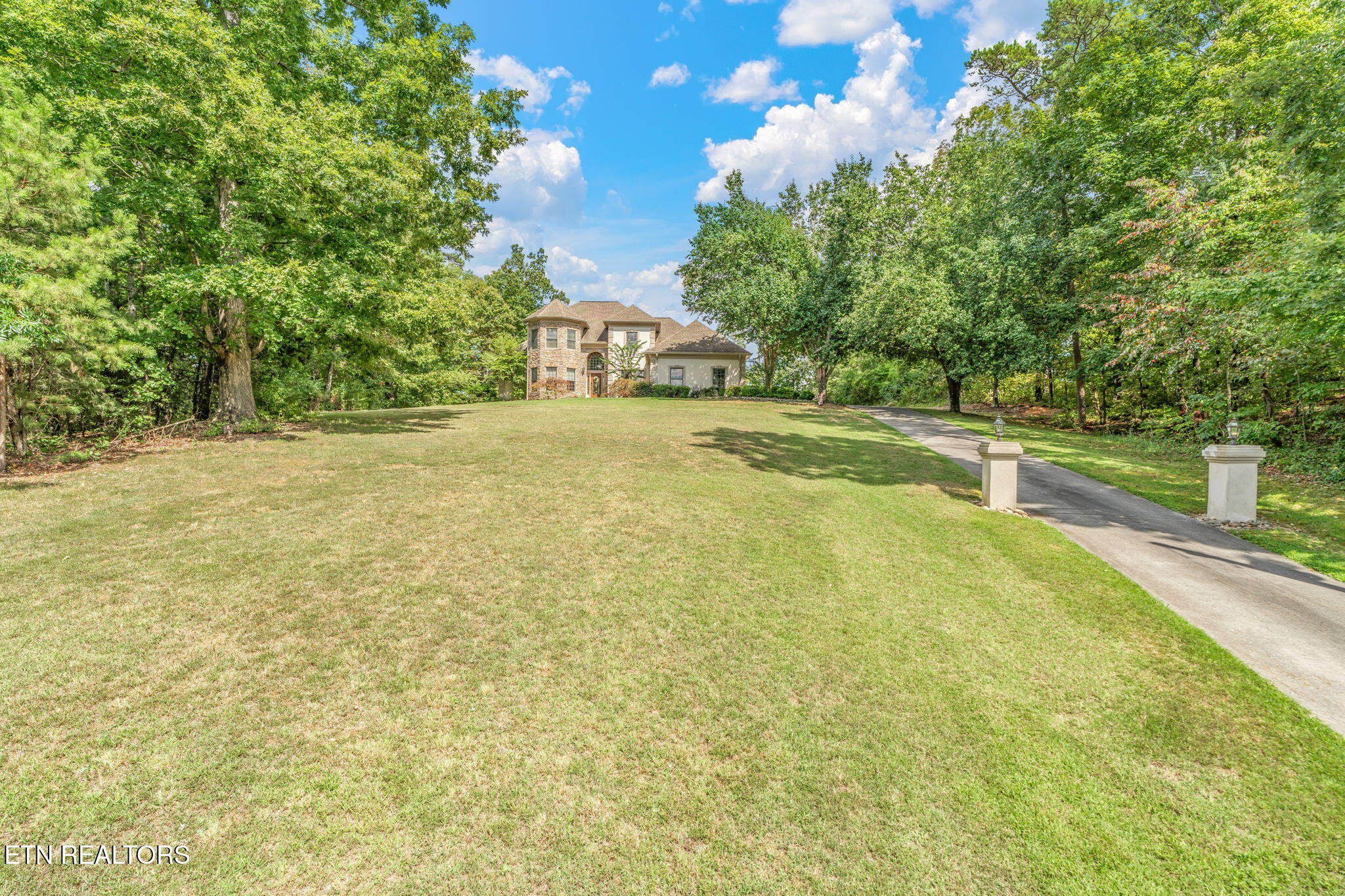 2572 Little Valley Road Loudon, TN 37774 - Photo 48 of 57 a view of a house with a yard and a large tree