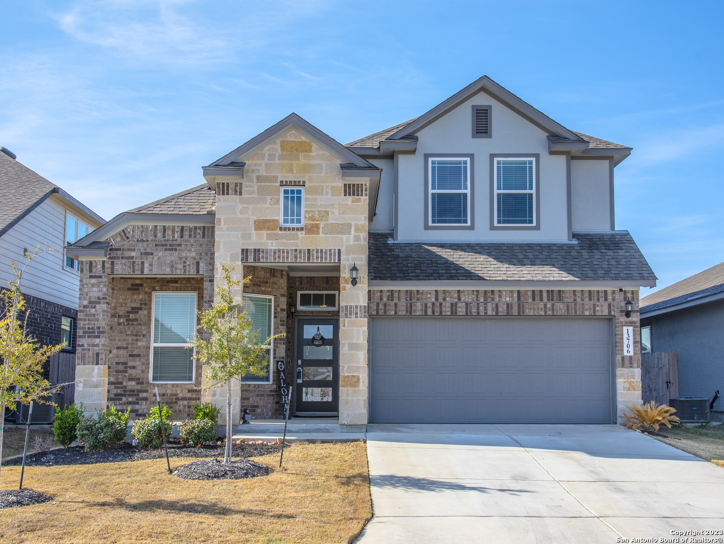 a front view of a house with a yard
