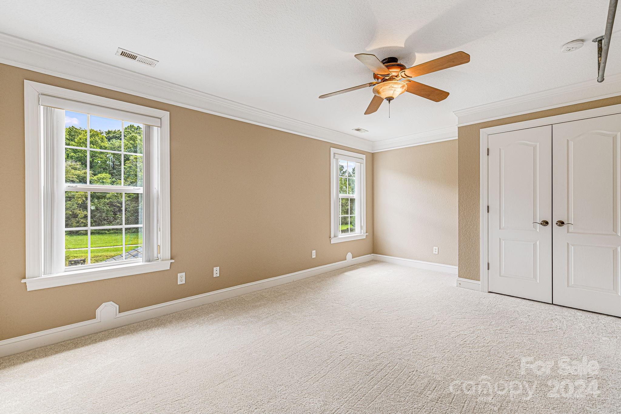 385 Wildbriar Road Fletcher, NC 28732 - Photo 28 of 42 a view of an empty room with a window