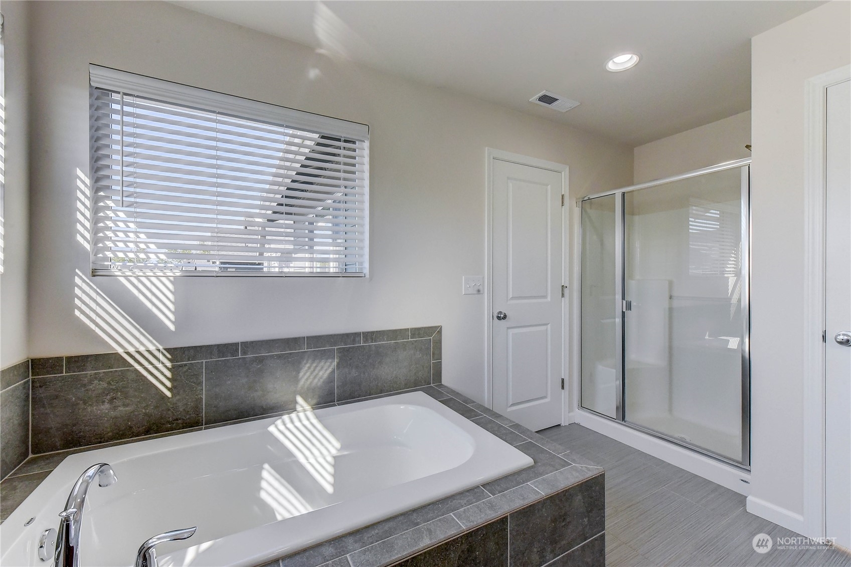 4501 30th Drive Southeast Everett, WA 98203 - Photo 11 of 29 a bathroom with a tub and a sink