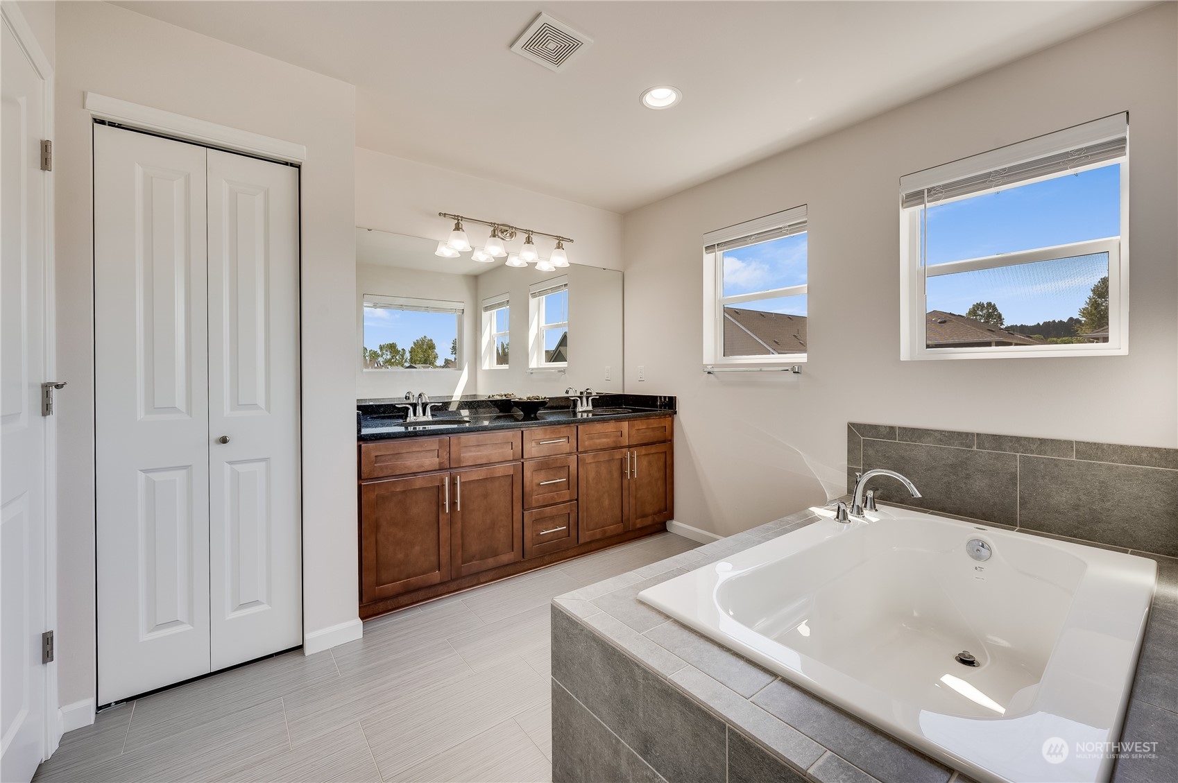 4501 30th Drive Southeast Everett, WA 98203 - Photo 22 of 29 a bath room with a sink and a mirror