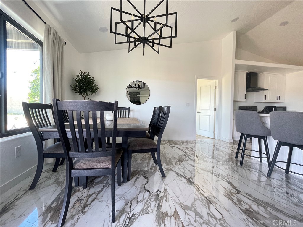 11375 4th Hesperia, CA 92345 - Photo 12 of 37 a view of a dining room with furniture and wooden floor
