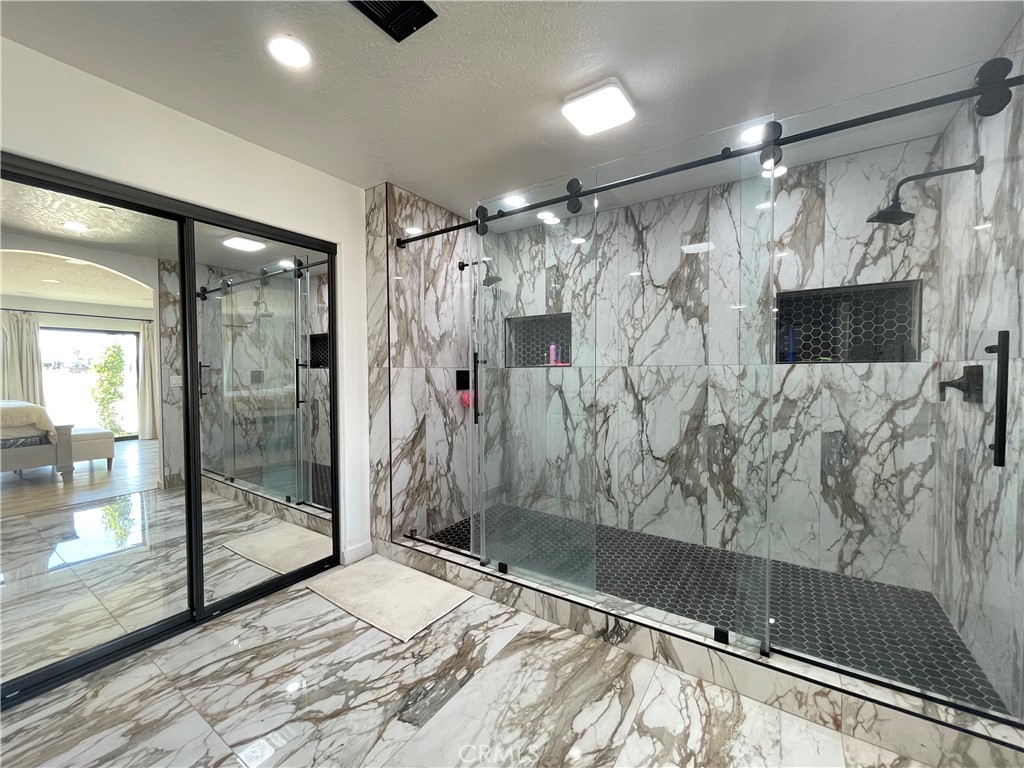 11375 4th Hesperia, CA 92345 - Photo 16 of 37 a bathroom with a shower and a bathtub