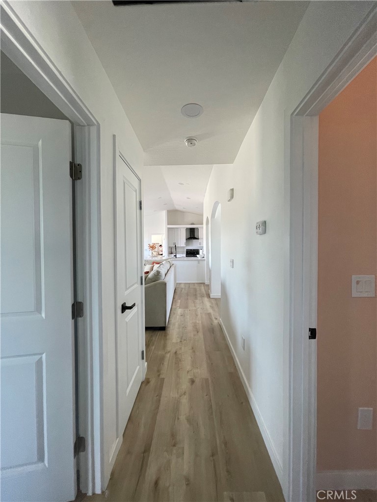 11375 4th Hesperia, CA 92345 - Photo 21 of 37 a view of a hallway with a white kitchen