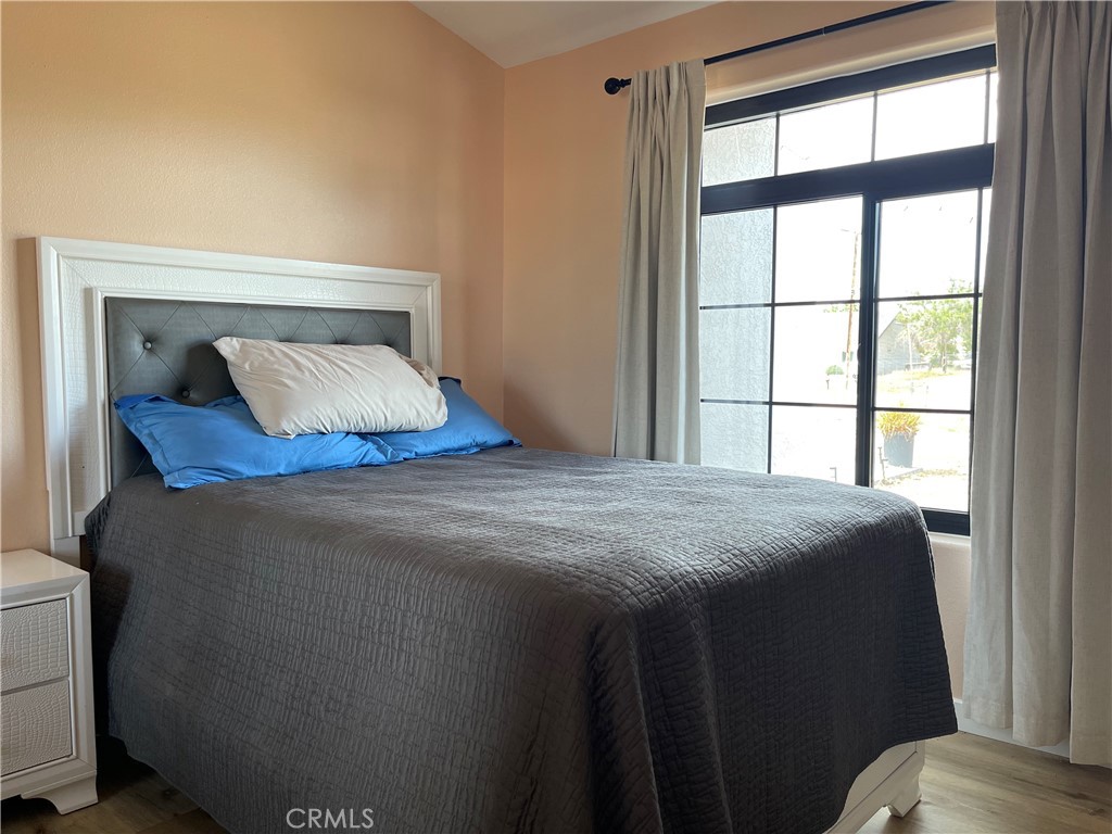 11375 4th Hesperia, CA 92345 - Photo 24 of 37 a bedroom with a bed and a window