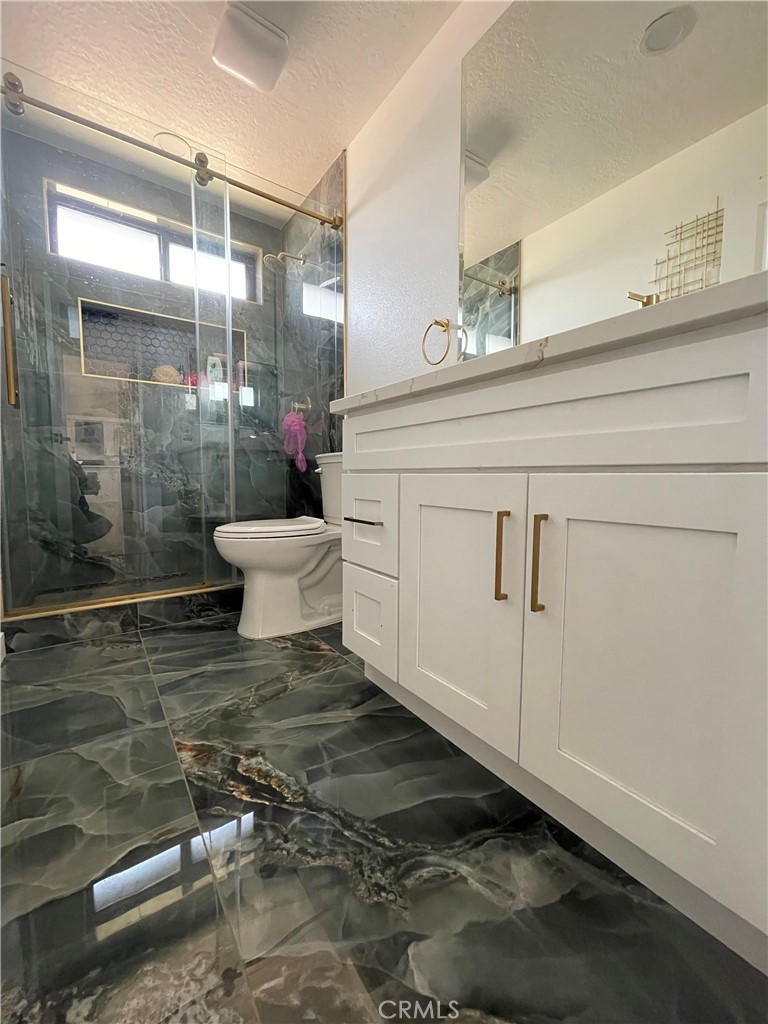 11375 4th Hesperia, CA 92345 - Photo 26 of 37 a bathroom with a sink and a mirror