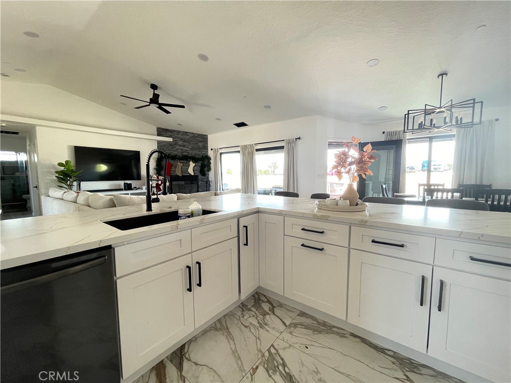 11375 4th Hesperia, CA 92345 - Photo 30 of 37 a kitchen with white cabinets and white appliances