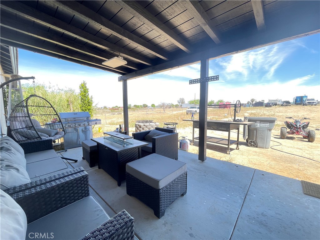 11375 4th Hesperia, CA 92345 - Photo 33 of 37 a living room with furniture and floor to ceiling windows