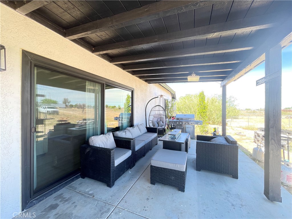 11375 4th Hesperia, CA 92345 - Photo 35 of 37 a living room with furniture and a large window