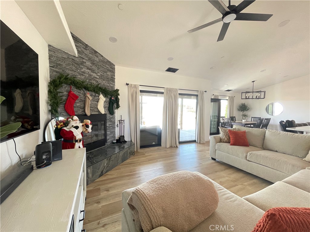 11375 4th Hesperia, CA 92345 - Photo 8 of 37 a living room with furniture and a flat screen tv