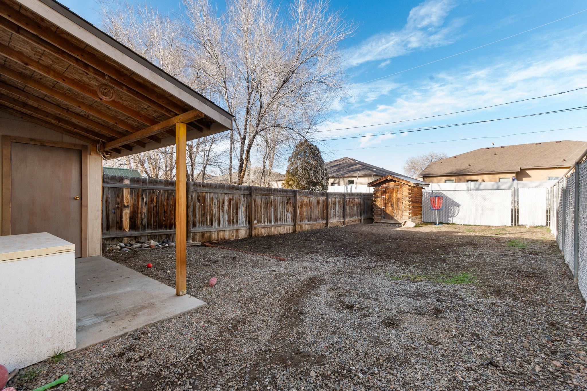 559 West Pabor Way, Unit 4 Fruita, CO 81521 - Photo 14 of 16 a view of a house with a backyard