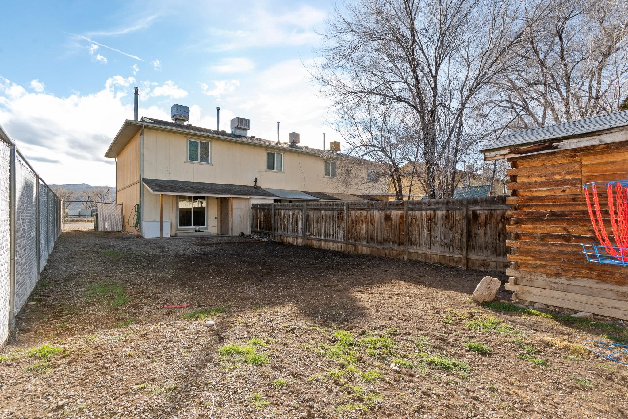 559 West Pabor Way, Unit 4 Fruita, CO 81521 - Photo 15 of 16 a view of a house with a yard