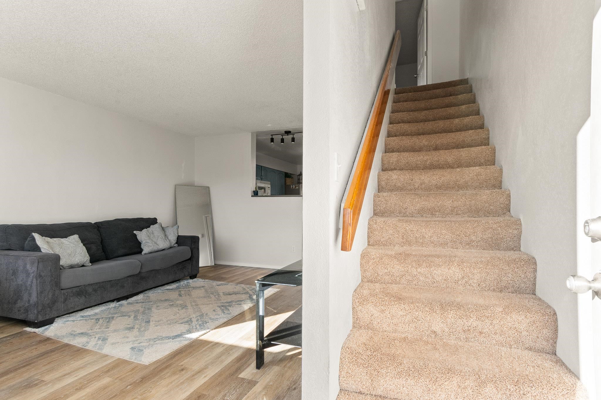 559 West Pabor Way, Unit 4 Fruita, CO 81521 - Photo 2 of 16 a living room with furniture and stairs