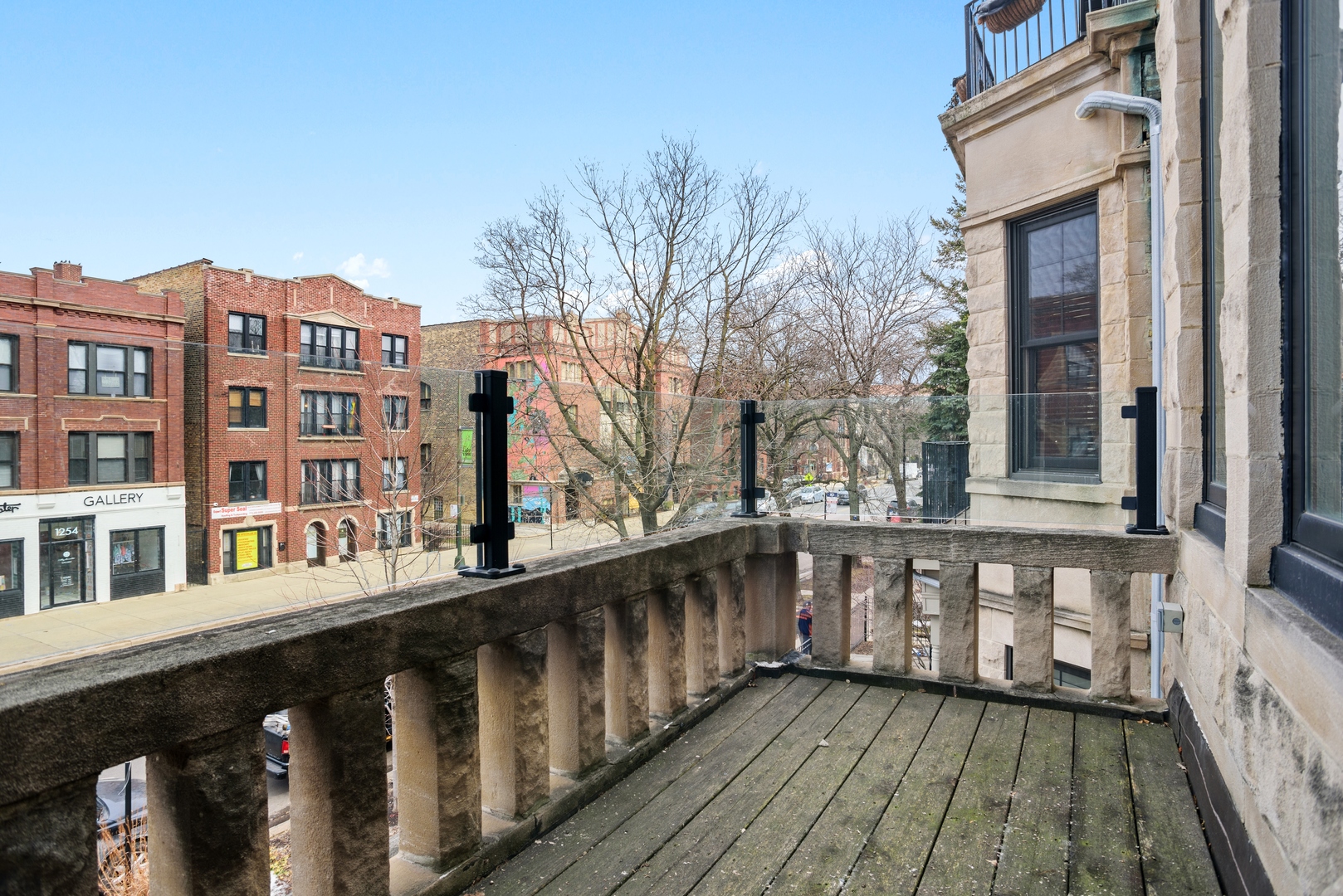 1257 West Addison Street, Unit 2 Chicago, IL 60613 - Photo 3 of 11 a view of a wooden house with large windows