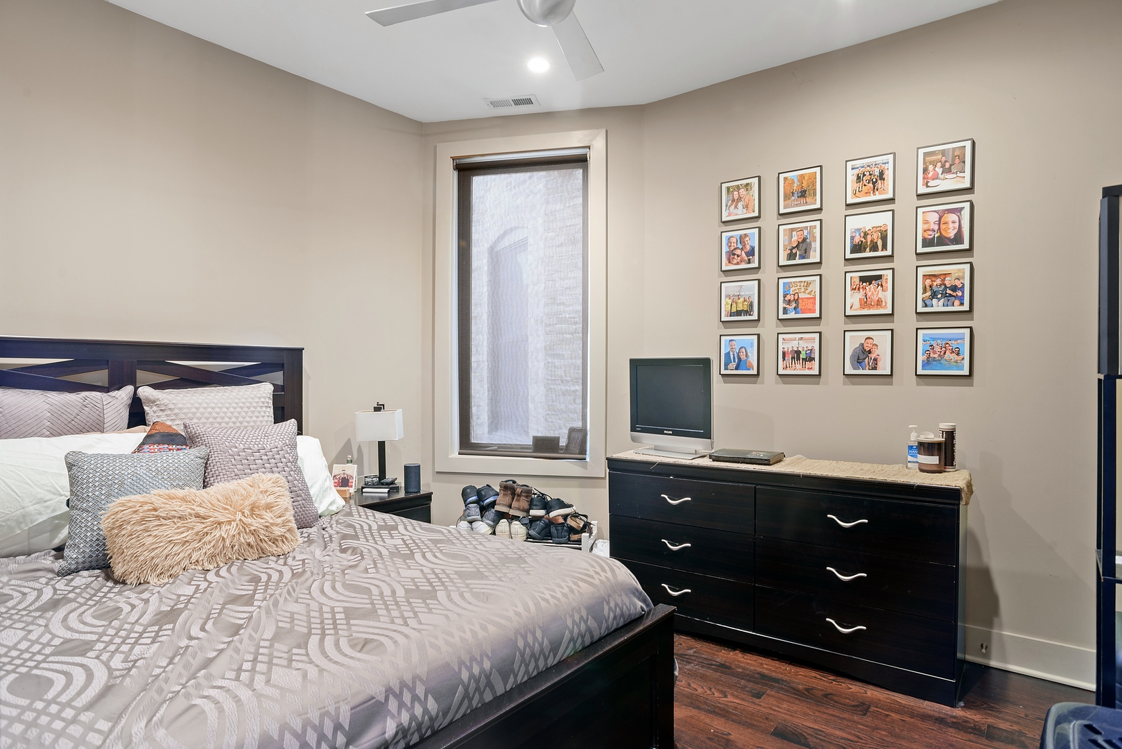 1257 West Addison Street, Unit 2 Chicago, IL 60613 - Photo 6 of 11 a bedroom with a bed and a night stand