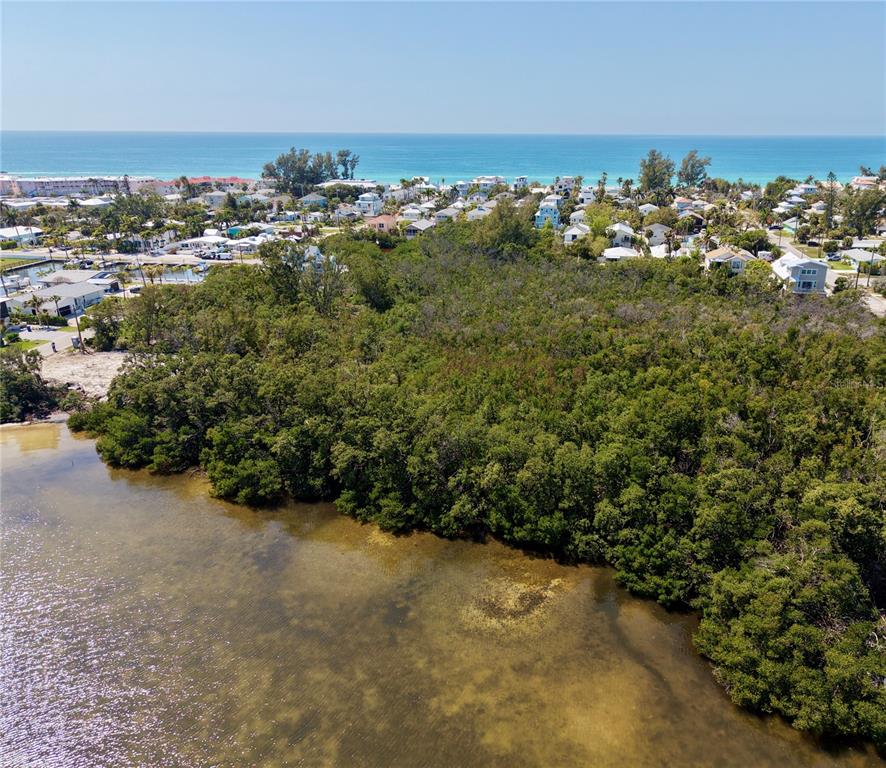 28th Street Holmes Beach, FL 34217 - Photo 7 of 7 an aerial view of a houses with a yard