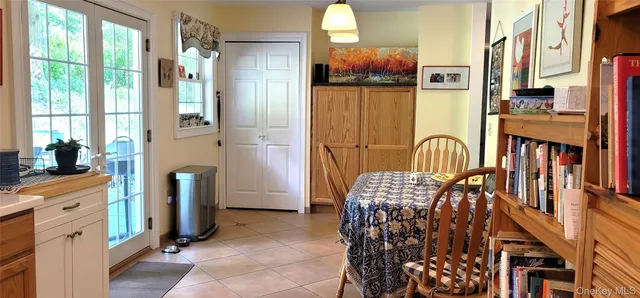a view of living room kitchen and entryway
