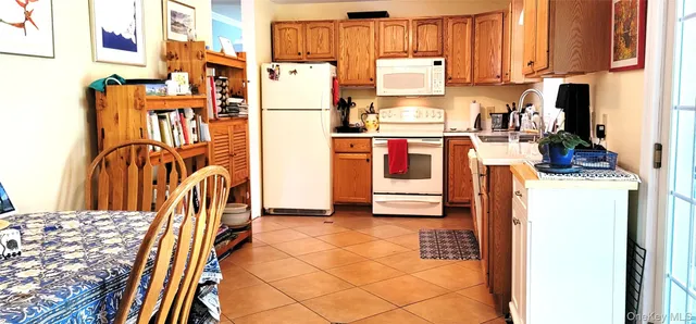 a view of a kitchen with appliances