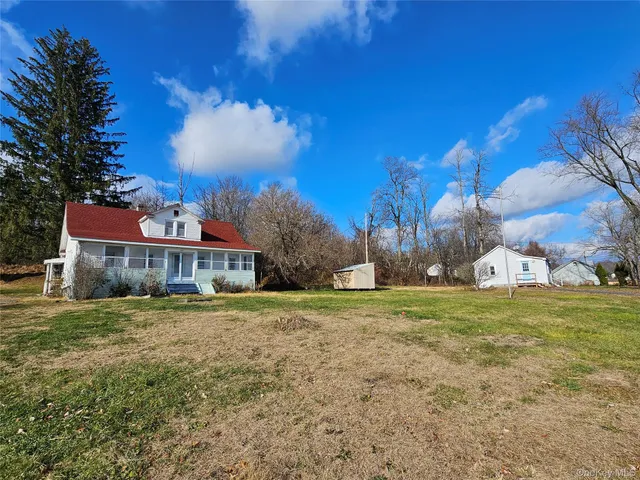 a view of a big yard with a house