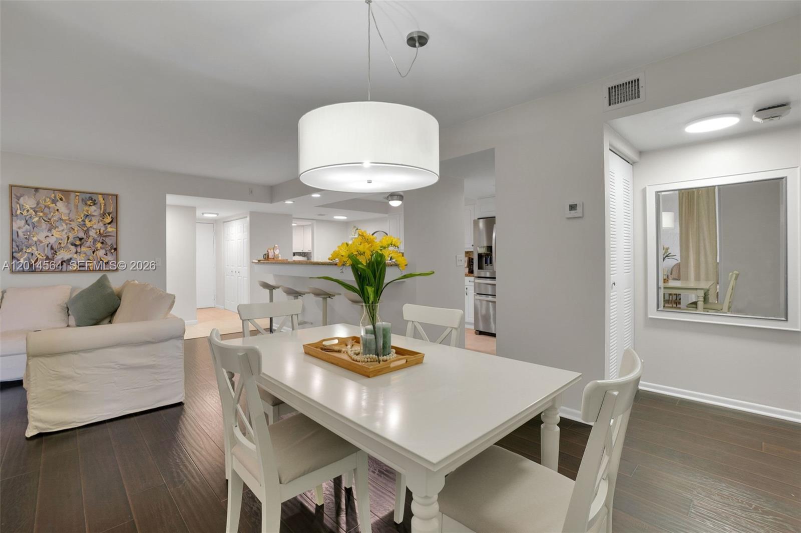 500 Egret Circle, Unit 8403 Delray Beach, FL 33444 - Photo 11 of 32 a living room with furniture and a potted plant