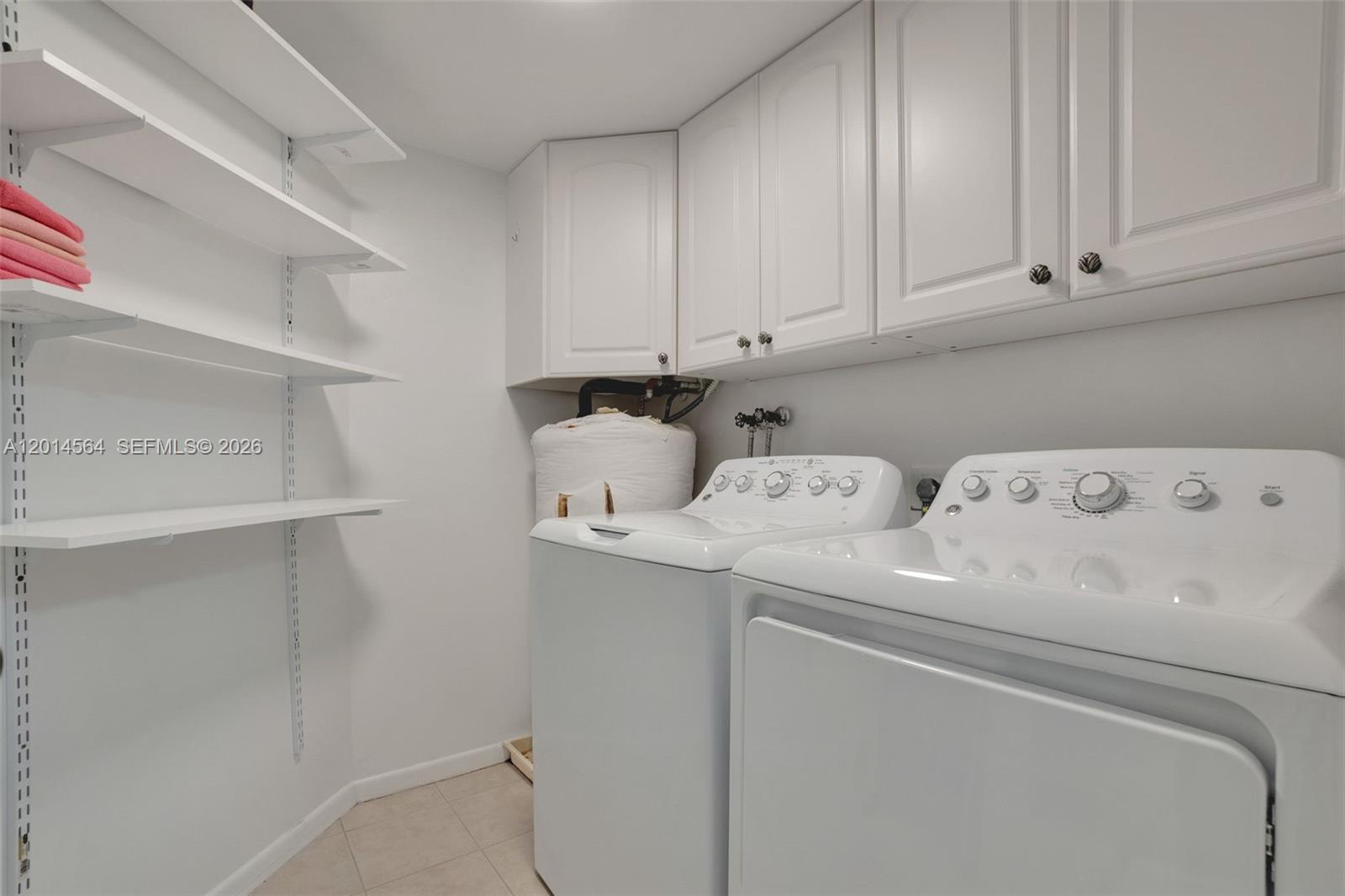 500 Egret Circle, Unit 8403 Delray Beach, FL 33444 - Photo 21 of 32 a utility room with dryer and washer