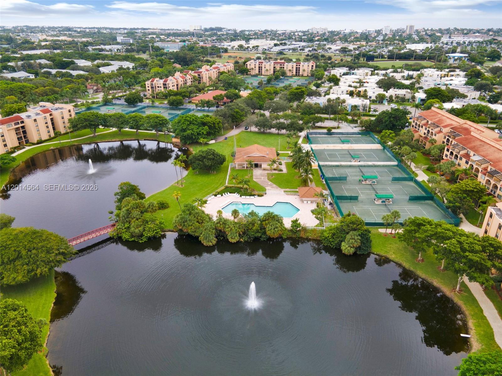 500 Egret Circle, Unit 8403 Delray Beach, FL 33444 - Photo 29 of 32 an aerial view of a house with a garden and lake view