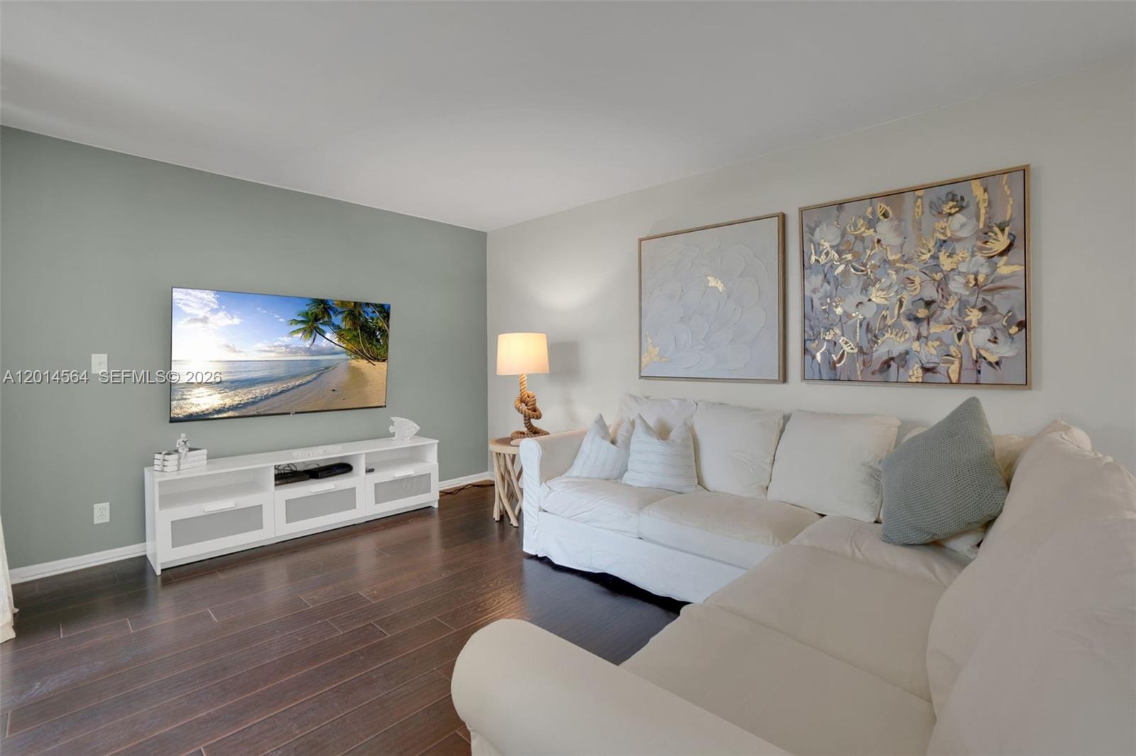 500 Egret Circle, Unit 8403 Delray Beach, FL 33444 - Photo 5 of 32 a living room with furniture and a flat screen tv