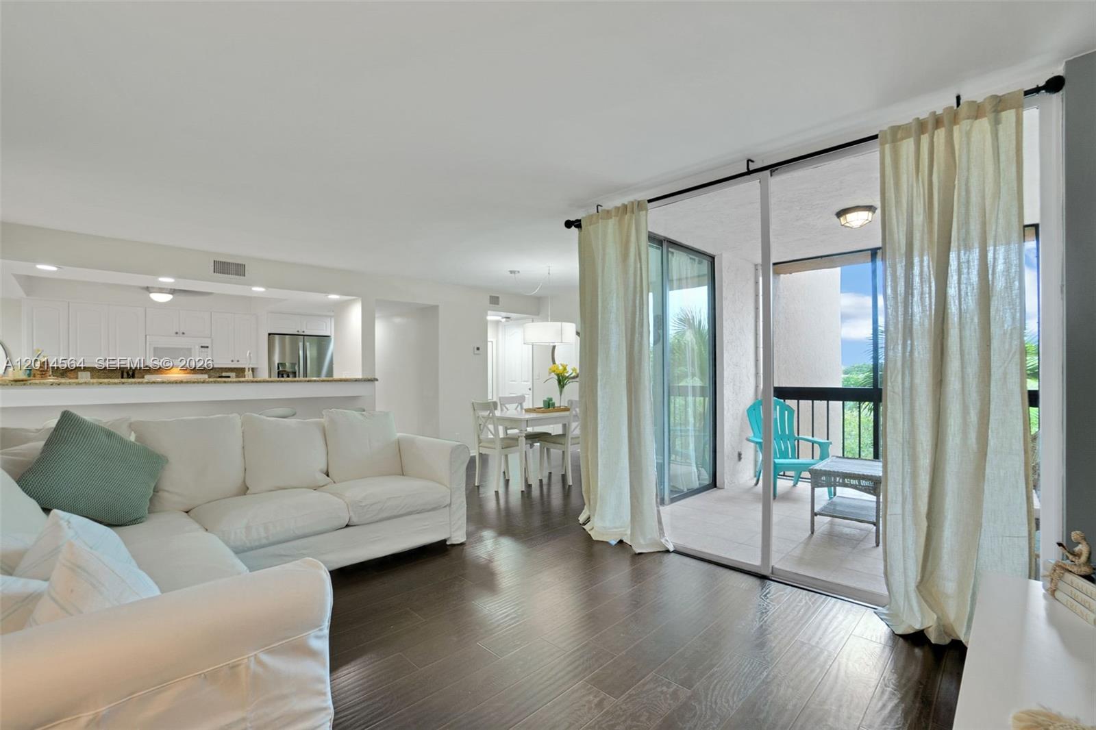 500 Egret Circle, Unit 8403 Delray Beach, FL 33444 - Photo 6 of 32 a living room with furniture and a large window