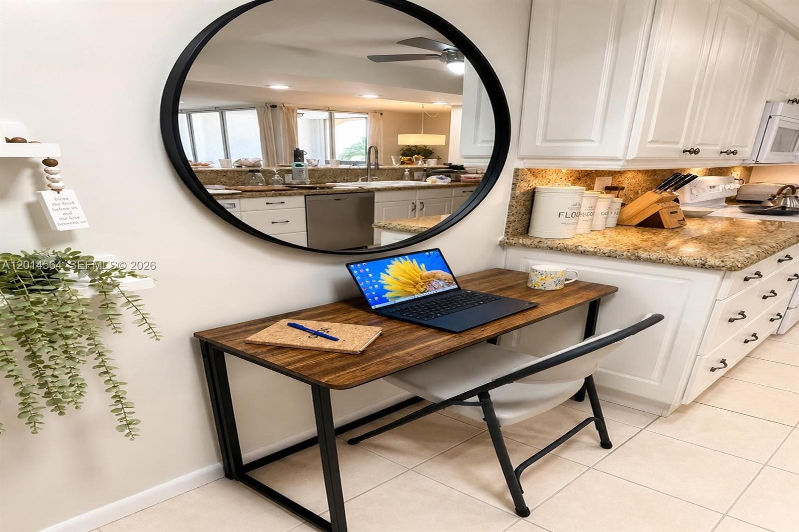 500 Egret Circle, Unit 8403 Delray Beach, FL 33444 - Photo 8 of 32 a view of a kitchen with kitchen island a stove a chimney a dining table and chairs