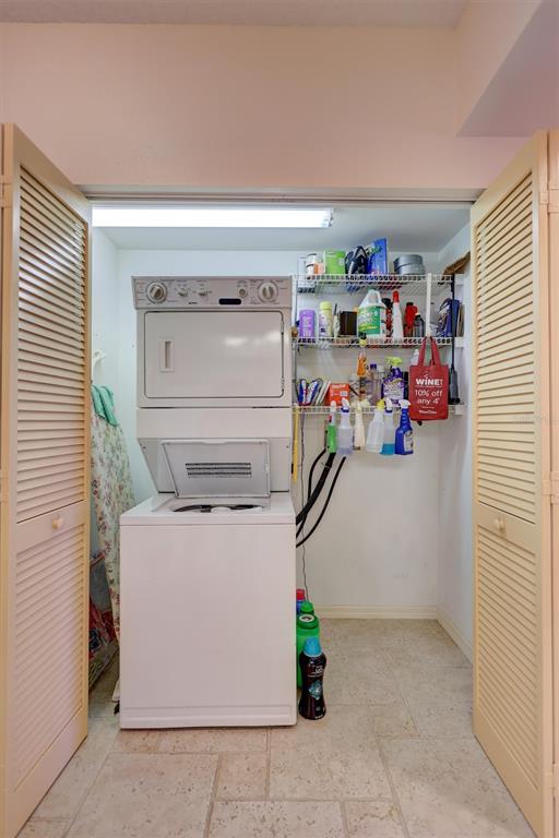 6475 Shoreline Drive, Unit 5102 St. Petersburg, FL 33708 - Photo 16 of 39 a utility room with dryer and washer