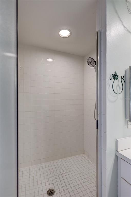 6475 Shoreline Drive, Unit 5102 St. Petersburg, FL 33708 - Photo 22 of 39 a bathroom with a shower