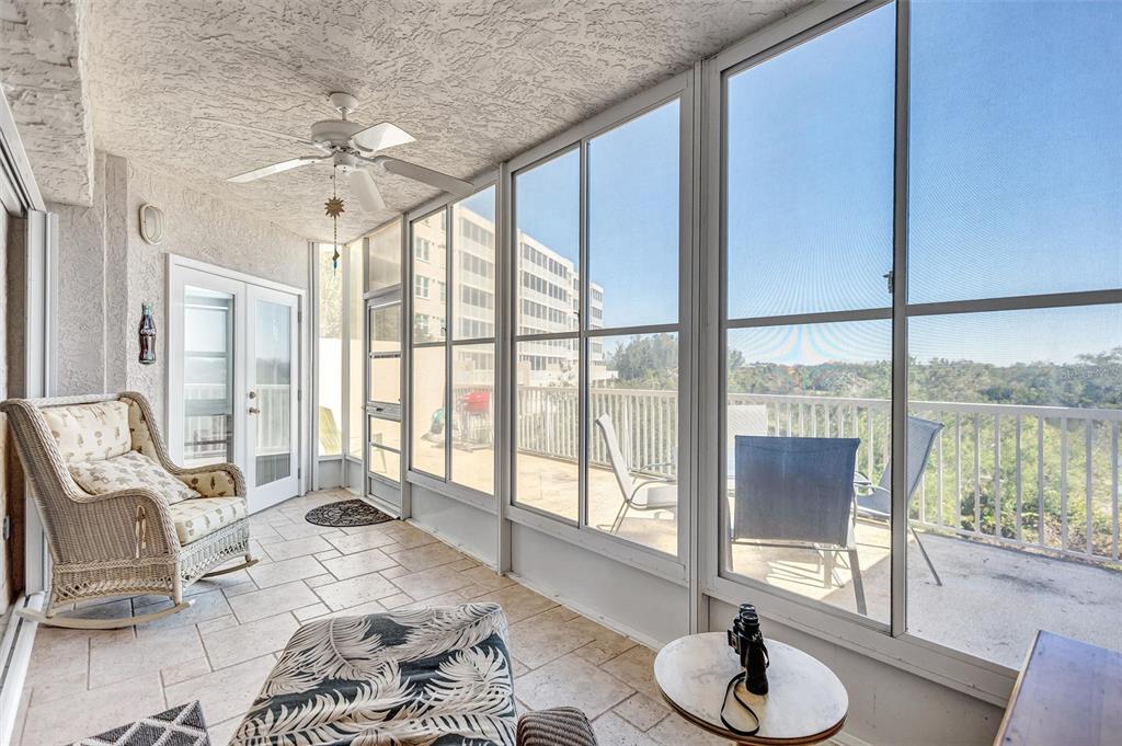 6475 Shoreline Drive, Unit 5102 St. Petersburg, FL 33708 - Photo 26 of 39 a living room with furniture and a large window