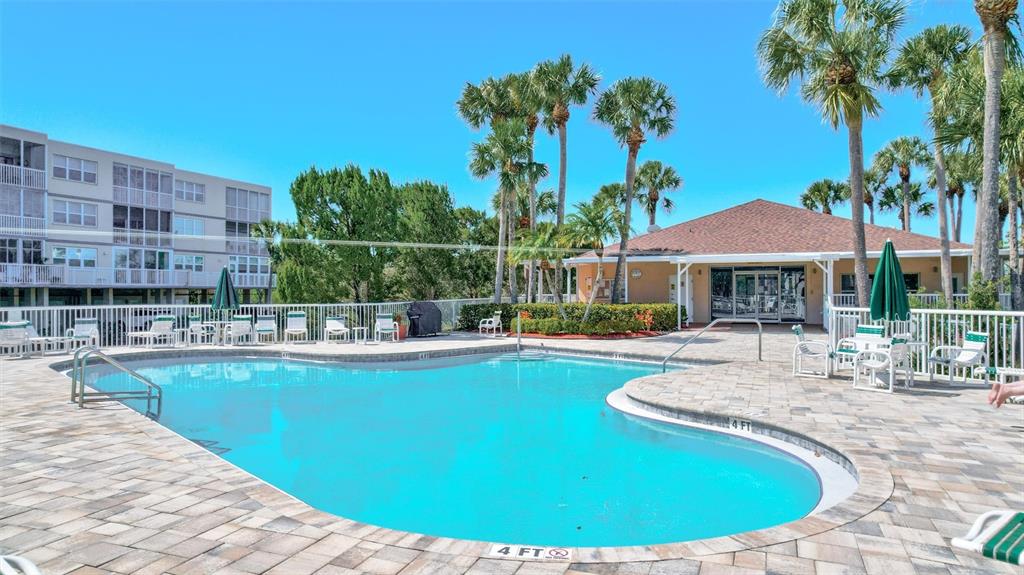 6475 Shoreline Drive, Unit 5102 St. Petersburg, FL 33708 - Photo 35 of 39 a view of a house with swimming pool and sitting area