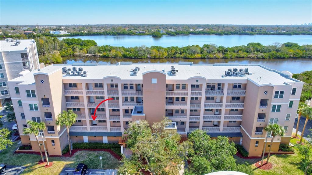 6475 Shoreline Drive, Unit 5102 St. Petersburg, FL 33708 - Photo 38 of 39 a view of building with outdoor space and lake view