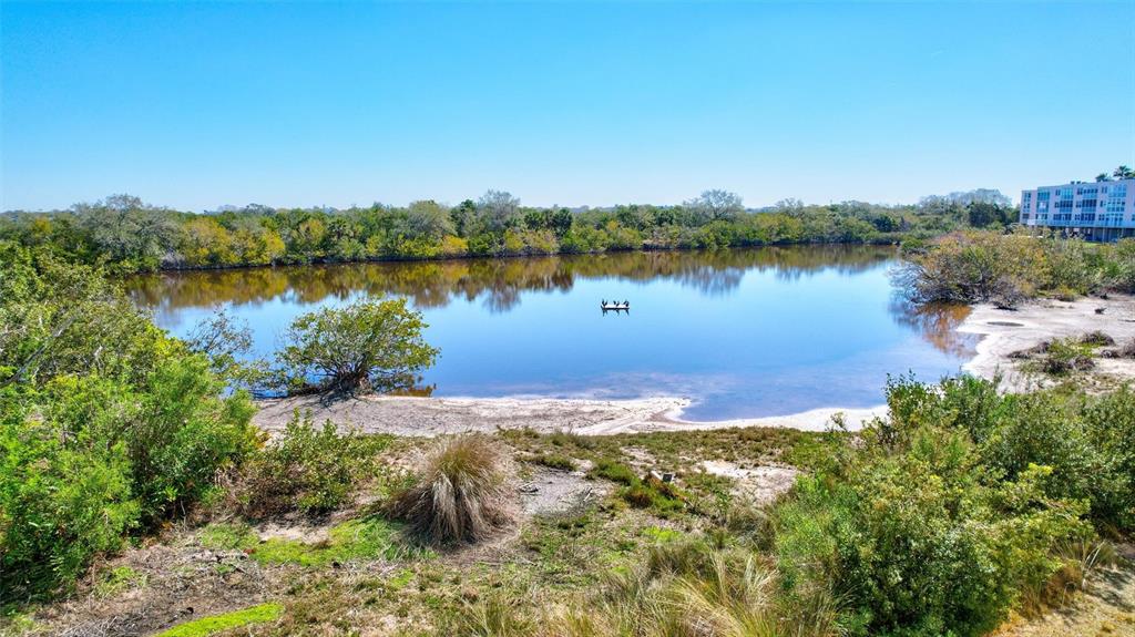 6475 Shoreline Drive, Unit 5102 St. Petersburg, FL 33708 - Photo 39 of 39 a view of a lake with houses in the back